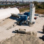 Concrete batching plant and industrial equipment in Novosibirsk, Russia, captured from above.